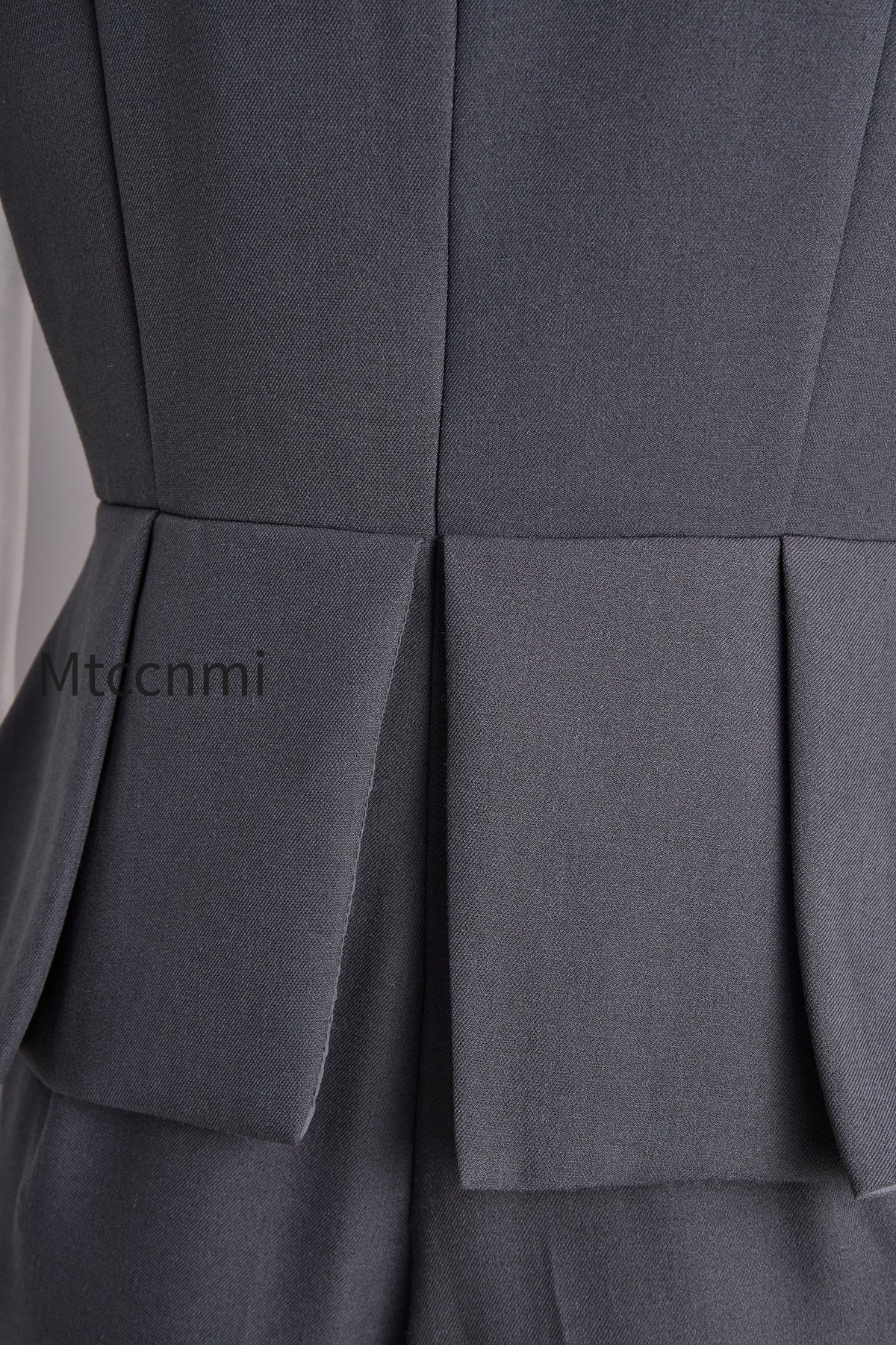 sophisticated-sleeveless-peplum-jumpsuit-in-charcoal-gray