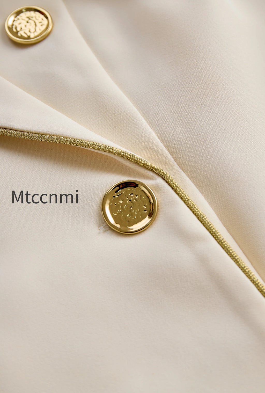 white-sleeveless-blazer-romper-with-gold-trim