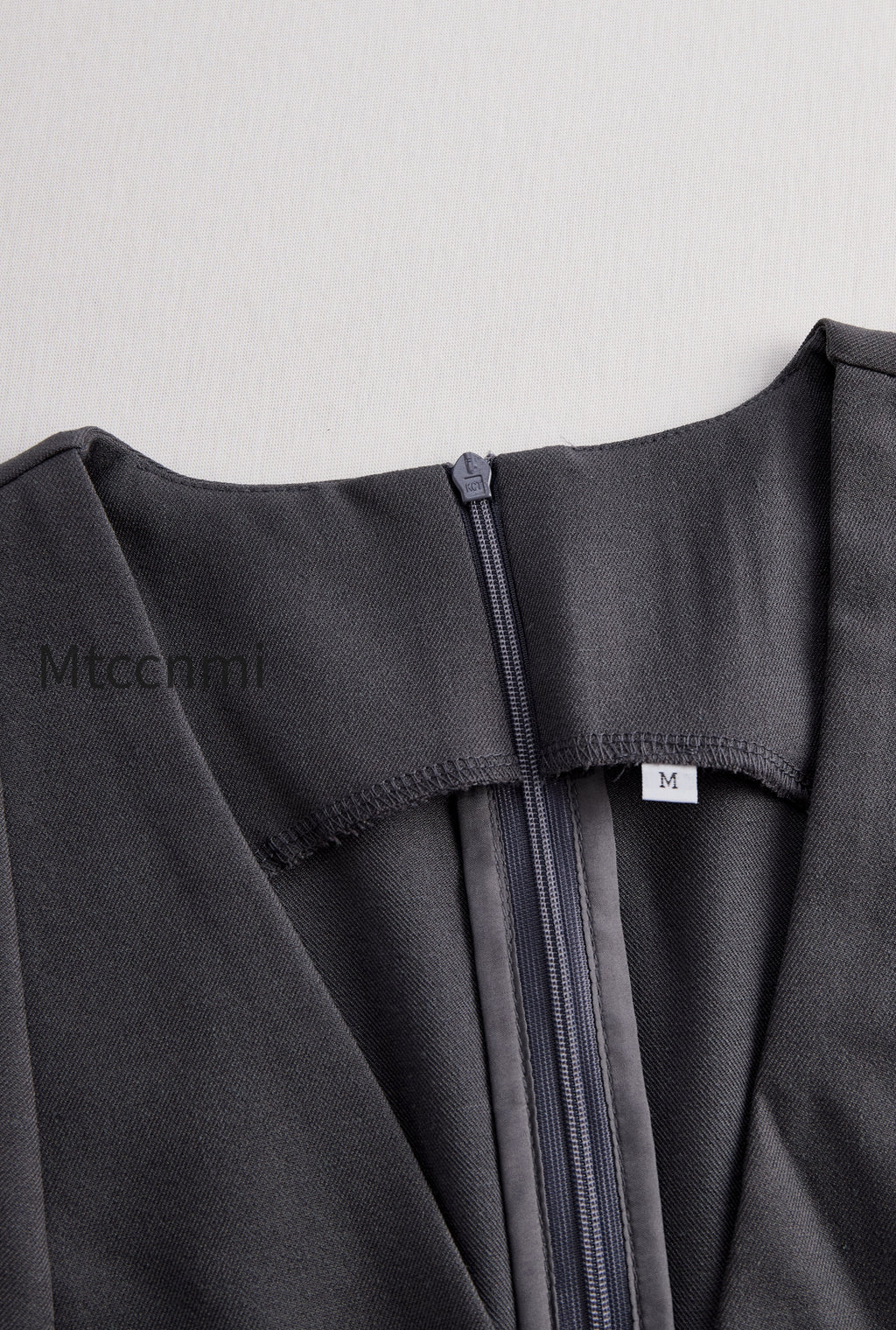 sophisticated-sleeveless-peplum-jumpsuit-in-charcoal-gray