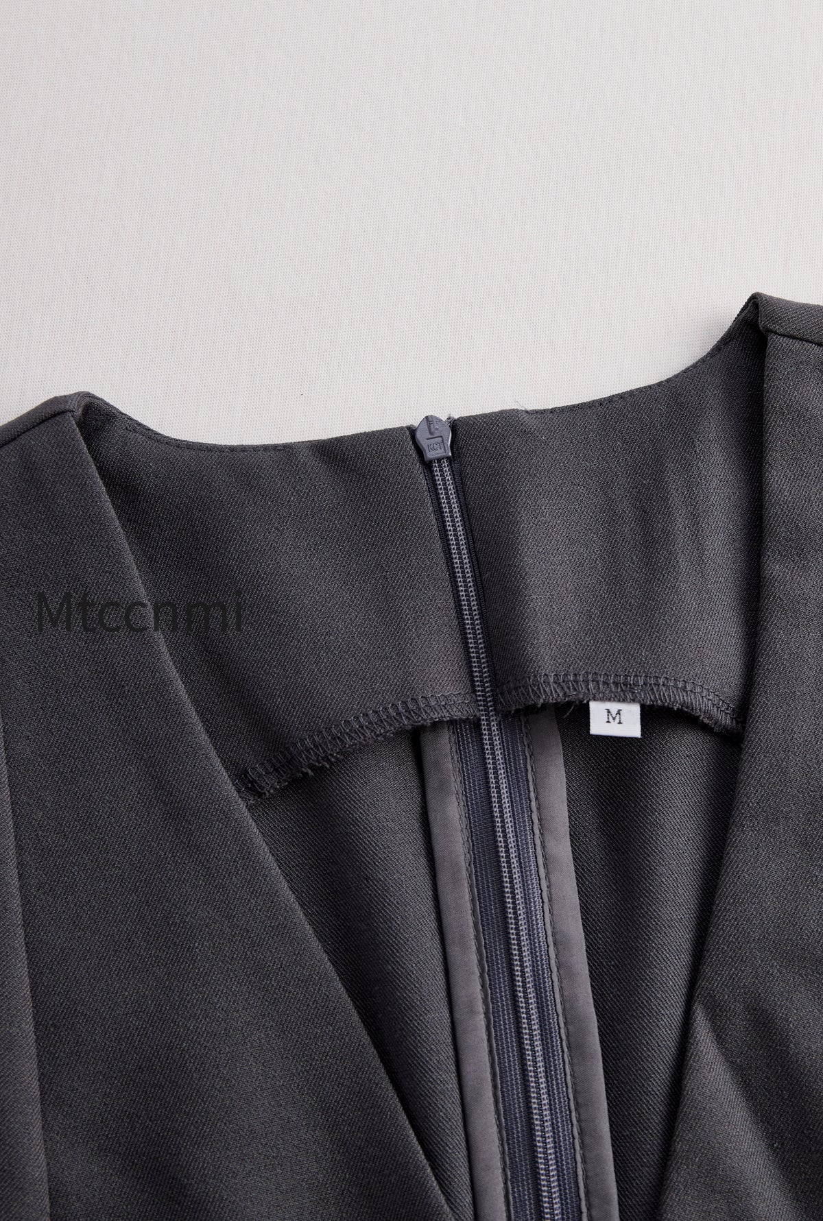 sophisticated-sleeveless-peplum-jumpsuit-in-charcoal-gray